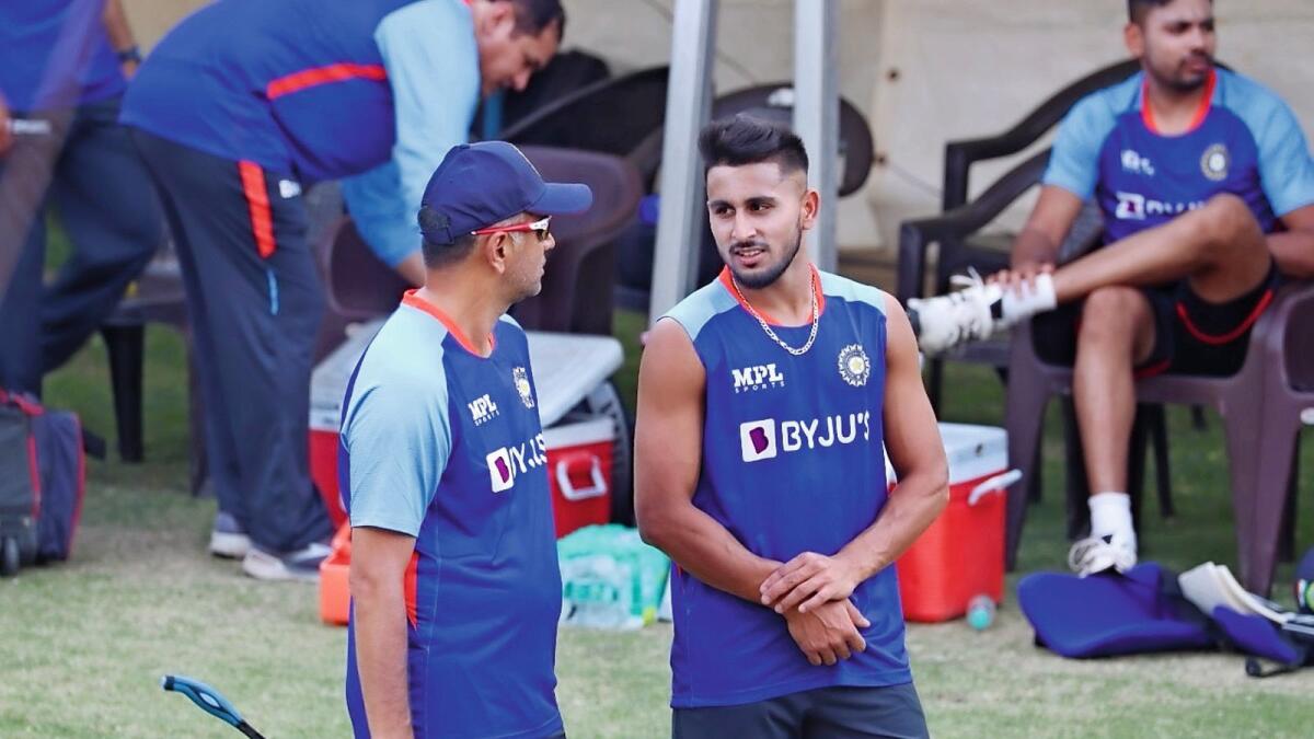 Indian coach Rahul Dravid (left) and Umran Malik during a practice session. — BCCI