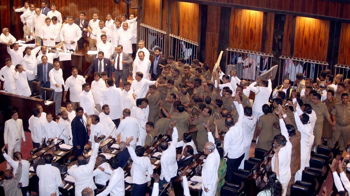 Sri Lanka lawmakers hurl chilli powder, chairs in Parliament commotion