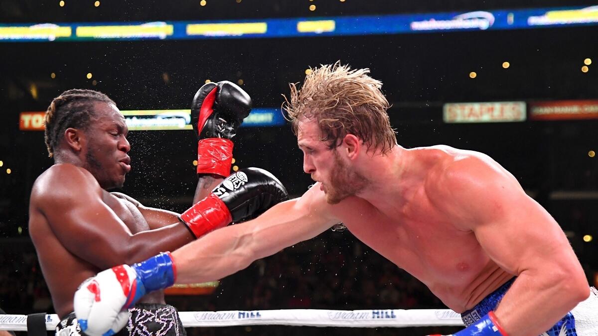 Logan Paul (right) throws a punch at KSI during their pro debut fight in Los Angeles on Sunday. (AFP)