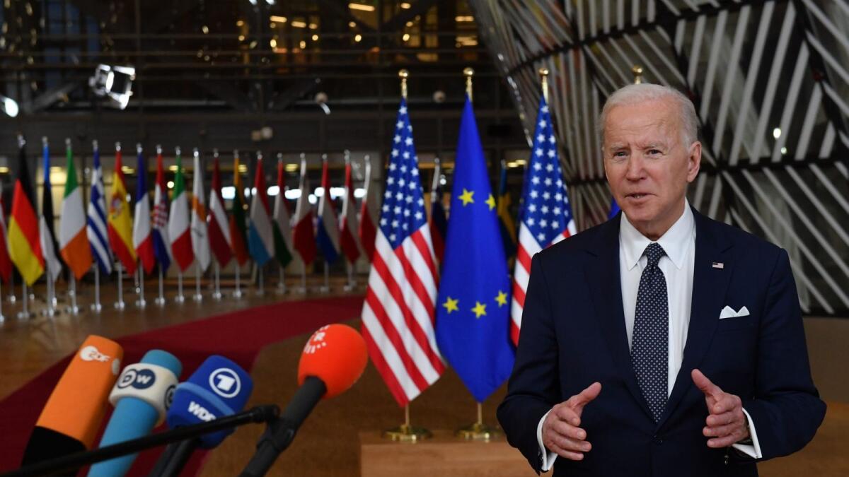 US President Joe Biden addresses media representatives as he arrives for a European Union (EU) summit at EU Headquarters in Brussels on March 24, 2022. Photo: AFP
