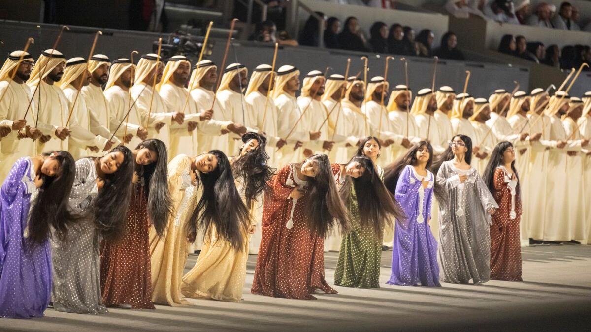 Performers participate in the 51st UAE National Day show, at Abu Dhabi National Exhibition Centre. - Wam photos
