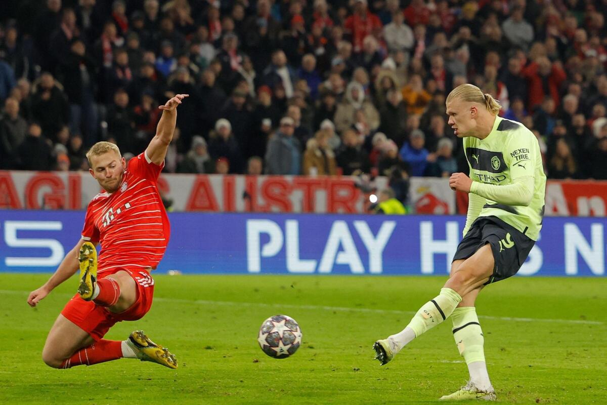 Manchester City's Erling Haaland (right) scores past Bayern Munich's Matthijs de Ligt. — AFP