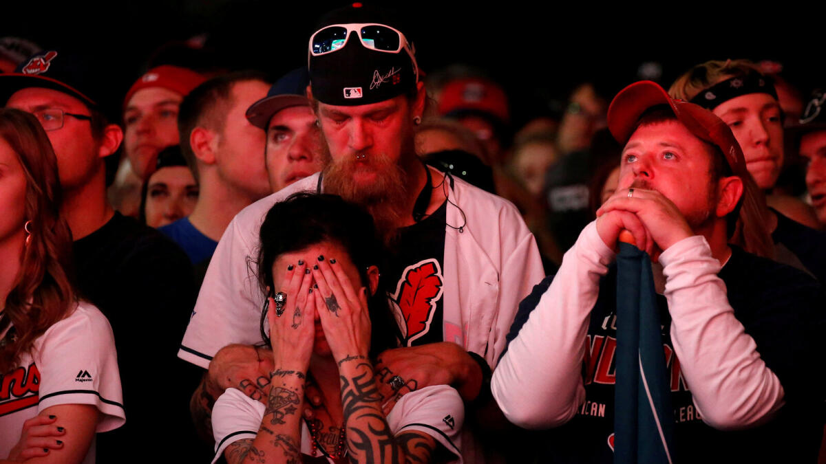Fans of the American League baseball team Cleveland Indians react while viewing Game 6 of their Major League Baseball World Series game against the National League baseball team Chicago Cubs outside Progressive Field in Cleveland, Ohio US, November 1, 2016.Reuters