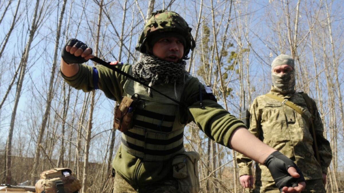 Ukrainian servicemen attend a training session on the Kharkiv outskirts. — AP