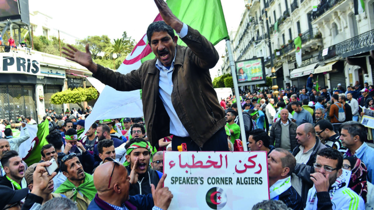 Algerian protesters defy police to keep up pressure on regime