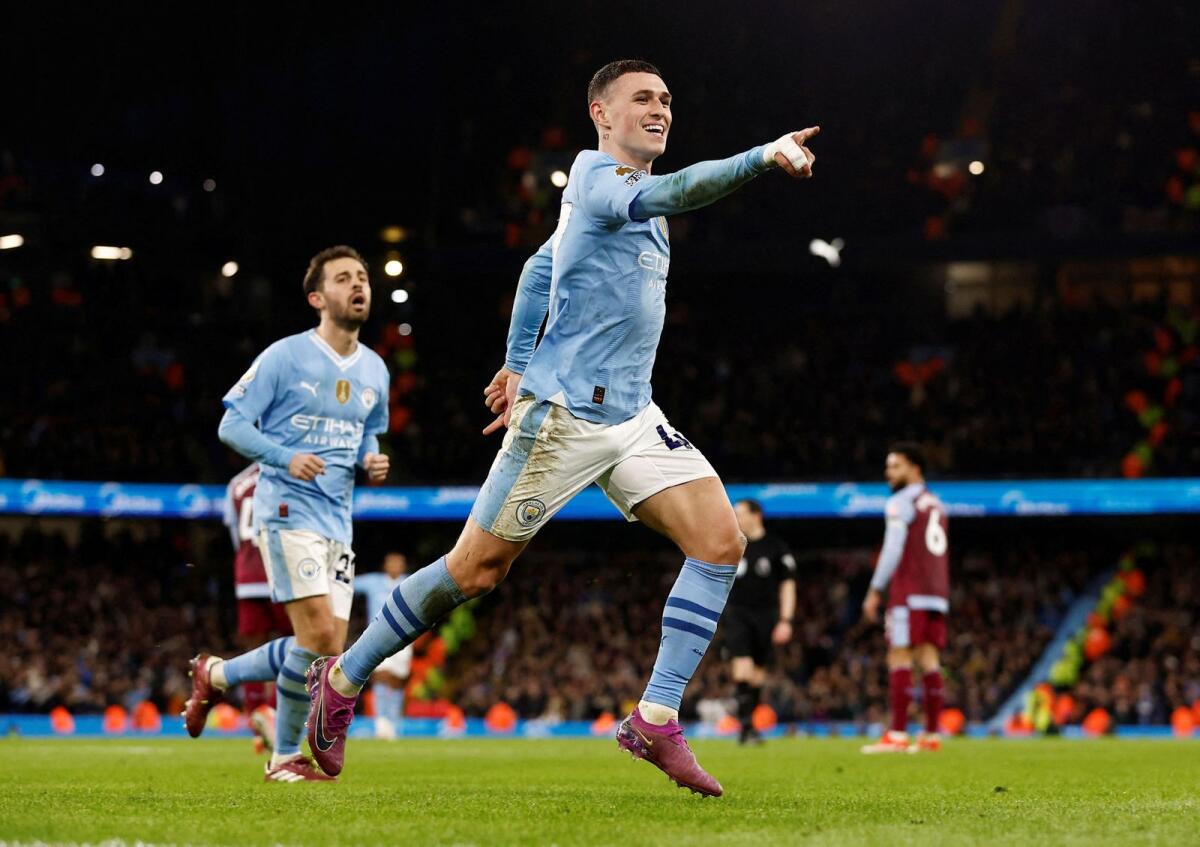 Manchester City's Phil Foden celebrates after scoring their third goal. — Reuters