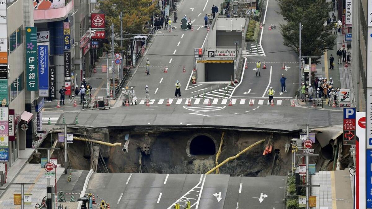 A massive sinkhole is created in the middle of the business district in Fukuoka, southern Japan.