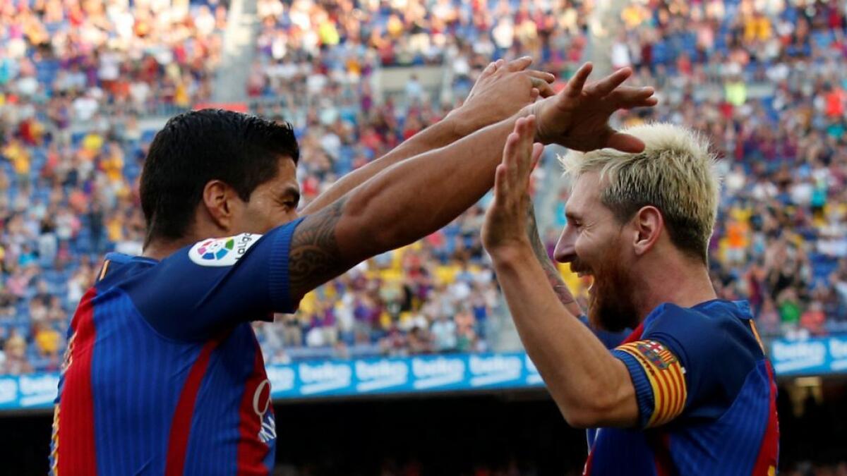 Football: Suarez treble and Messi double lift six-goal Barca