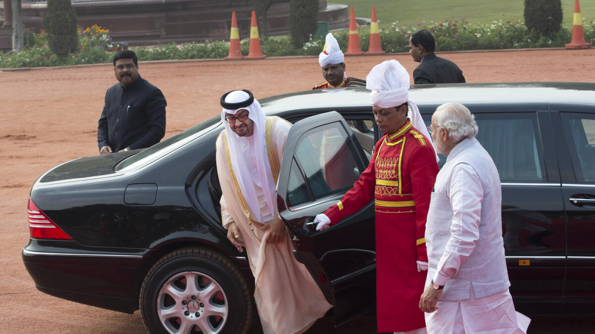 Indian Prime Minister Narendra Modi, right, waits to receive as His Highness Shaikh Mohammed bin Zayed Al Nahyan, Crown Prince of Abu Dhabi and Deputy Supreme Commander of the UAE Armed Forces, arrives at the Indian presidential palace, in New Delhi, India, Thursday, Feb. 11 2016.