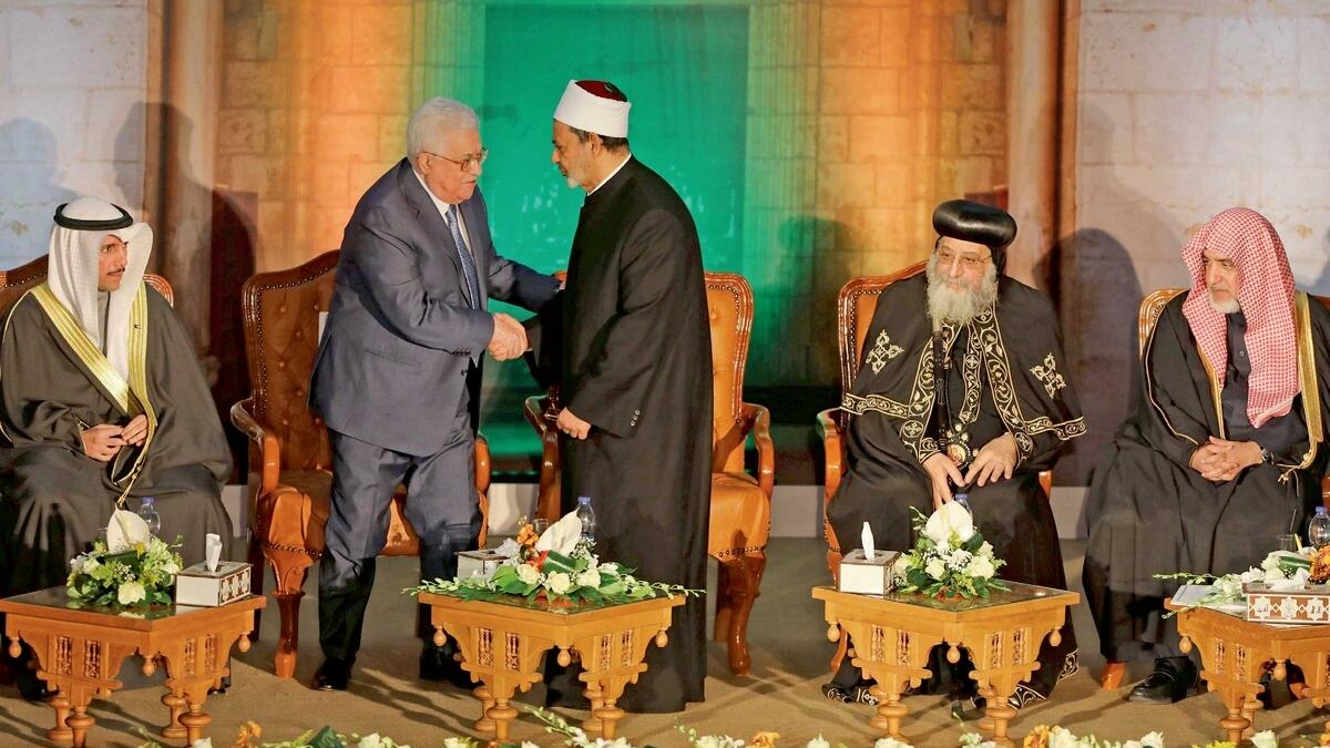 Grand Imam of Al Azhar Sheikh Ahmed Al Tayeb shakes hands with Palestinian President Mahmoud Abbas during Al Azhar’s conference on Jerusalem in Cairo, Egypt, on Wednesday. — Reuters