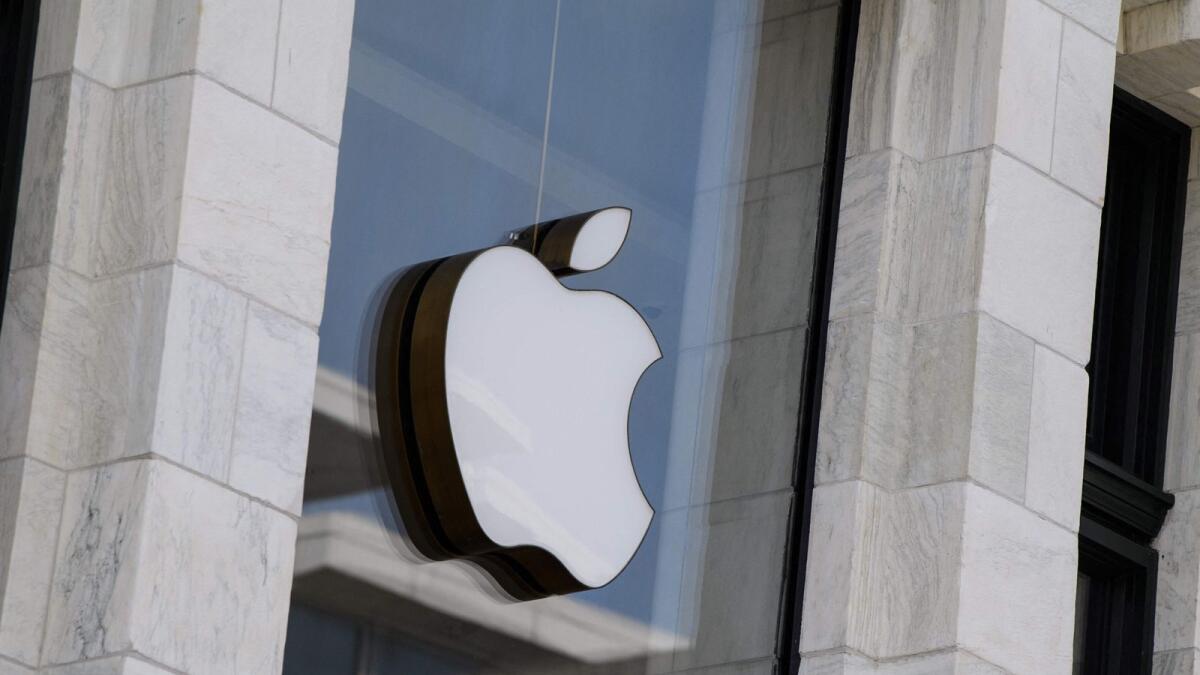 The Apple logo is seen at the entrance of an Apple store in Washington, DC. — AFP file