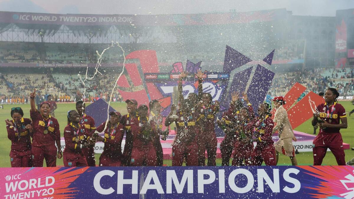 West Indies cricketers celebrate after winning the women's World T20 cricket tournament final match between Australia and West Indies at The Eden Gardens Cricket Stadium in Kolkata on April 3, 2016.