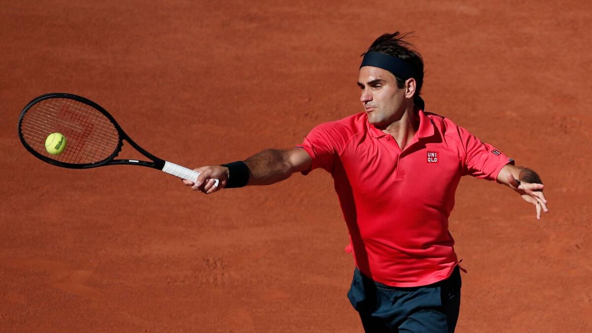 Switzerland's Roger Federer in action during his first round match against Uzbekistan's Denis Istomin. — Reuters