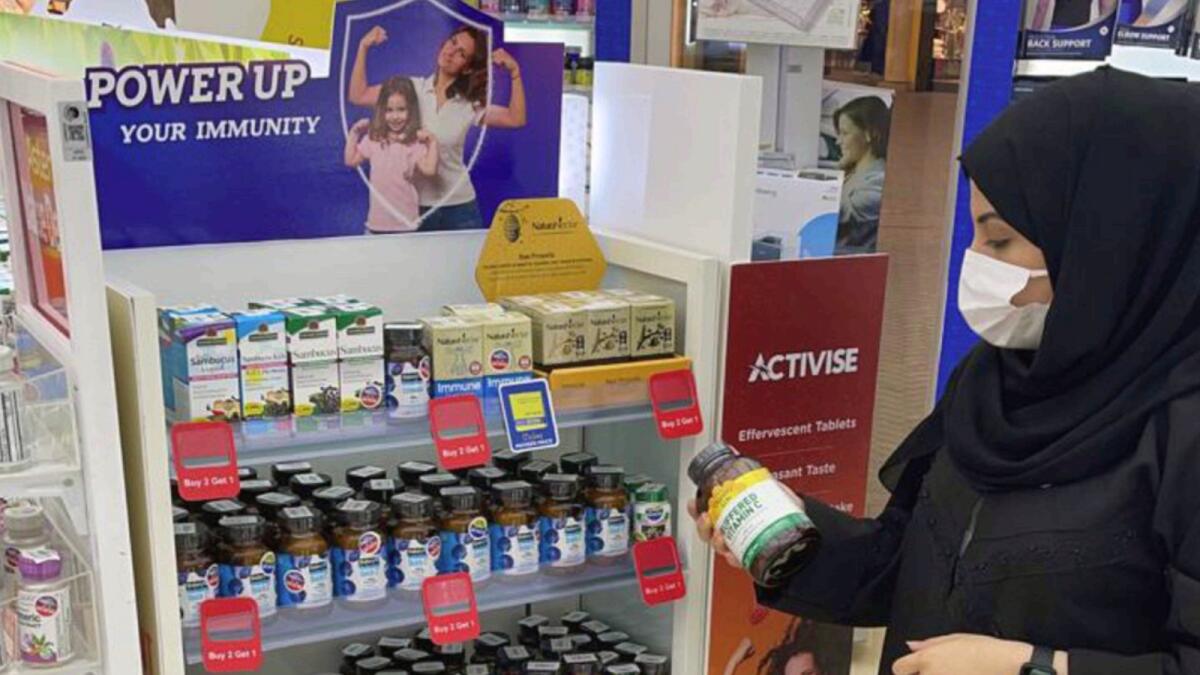 A customer checks vitamin supplements at a pharmacy in Abu Dhabi. — Supplied photo