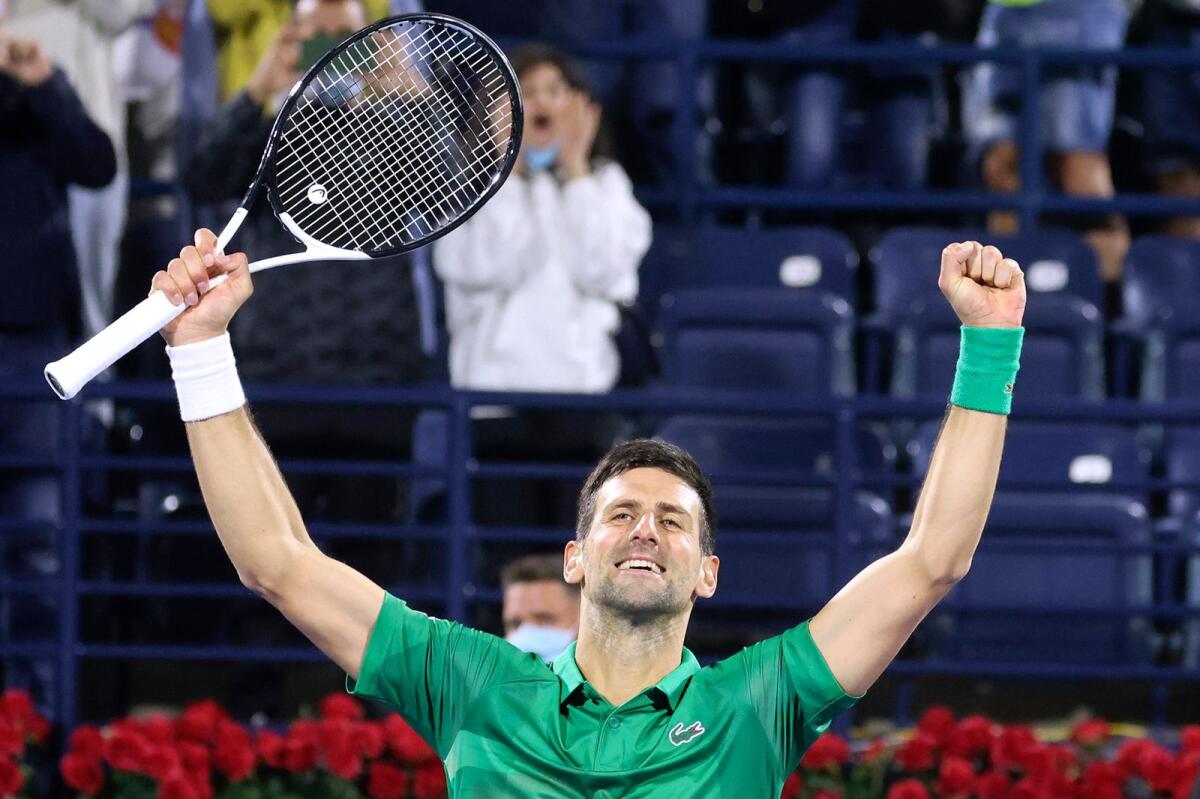 Novak Djokovic of Serbia celebrates after winning the ATP Dubai Duty Free Tennis Championships match against Lorenzo Musetti of Italy. (AFP)
