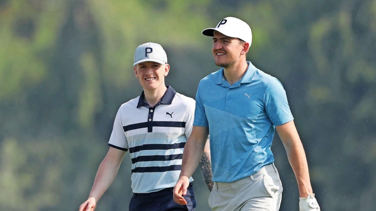 On a different pitch: Manchester United defender Harry Maguire (right) and Everton goalkeeper Jordan Pickford during the pro-am at the Emirates Golf Club in Dubai on Wednesday. — Supplied photo