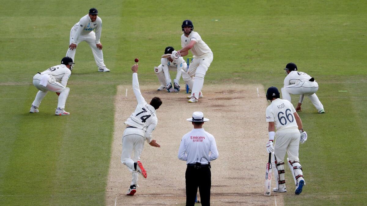 New Zealand's Mitchell Santner bowls to England's Dom Sibley on the fifth day of the first Test at Lord's Cricket Ground in London on Sunday. (AFP)