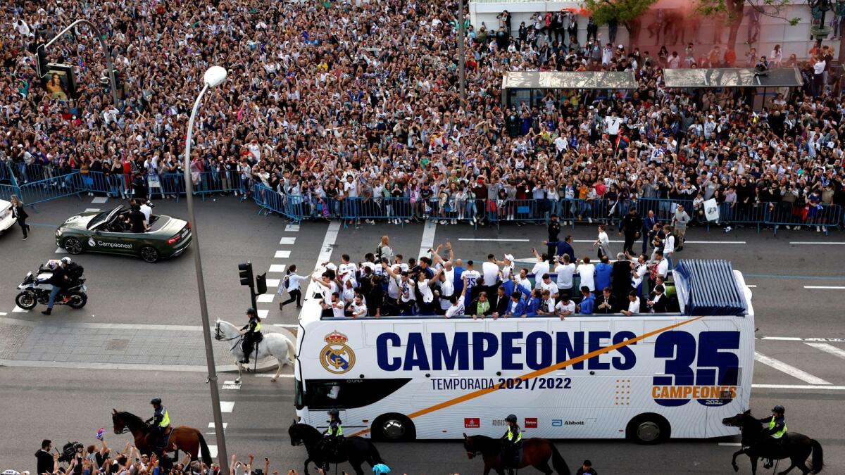 About 150,000 jubilant Real Madrid fans flocked to the city's central Cibeles fountain on Saturday to join the players for a celebration of their record-extending 35th La Liga title. (Reuters)