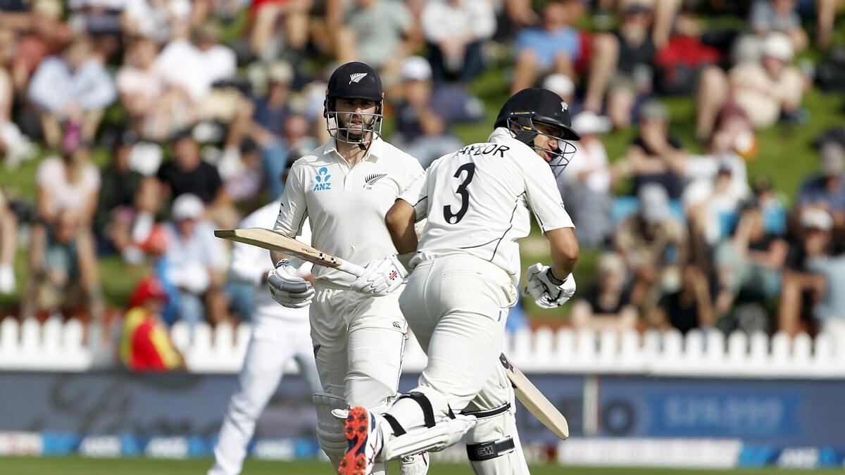 ADVANTAGE HOSTS: Kane Williamson and Ross Taylor run between the wicket during the second day of the first Test in Wellington.