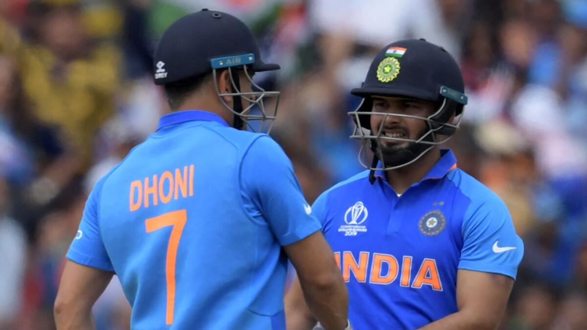Rishabh Pant often draws comparisons with MS Dhoni (left) but has maintained that he is aiming for a space of his own even though he does turn to the senior player for advice and mentorship. — AFP file