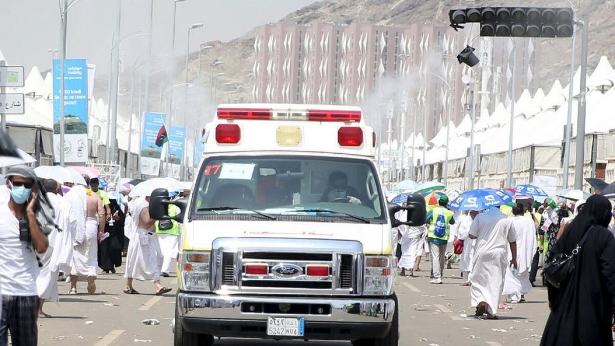 An ambulance evacuates victims following a crush caused by large numbers of people pushing at Mina.