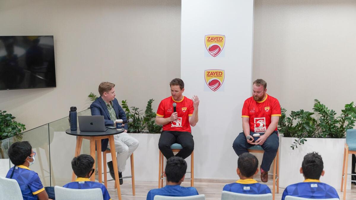 Eoin Morgan (centre) and Paul Stirling (right) interact with Zayed Cricket Academy youngsters. (Picture courtesy Abu Dhabi Cricket Council)
