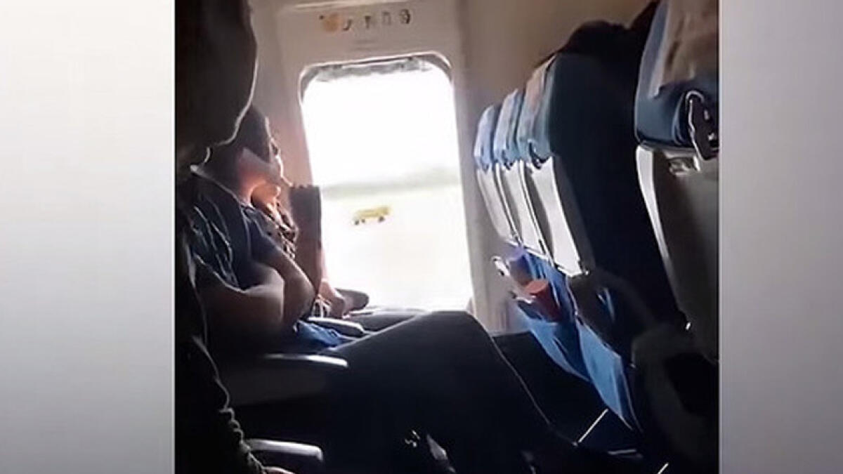 Video: Woman opens emergency door on flight 