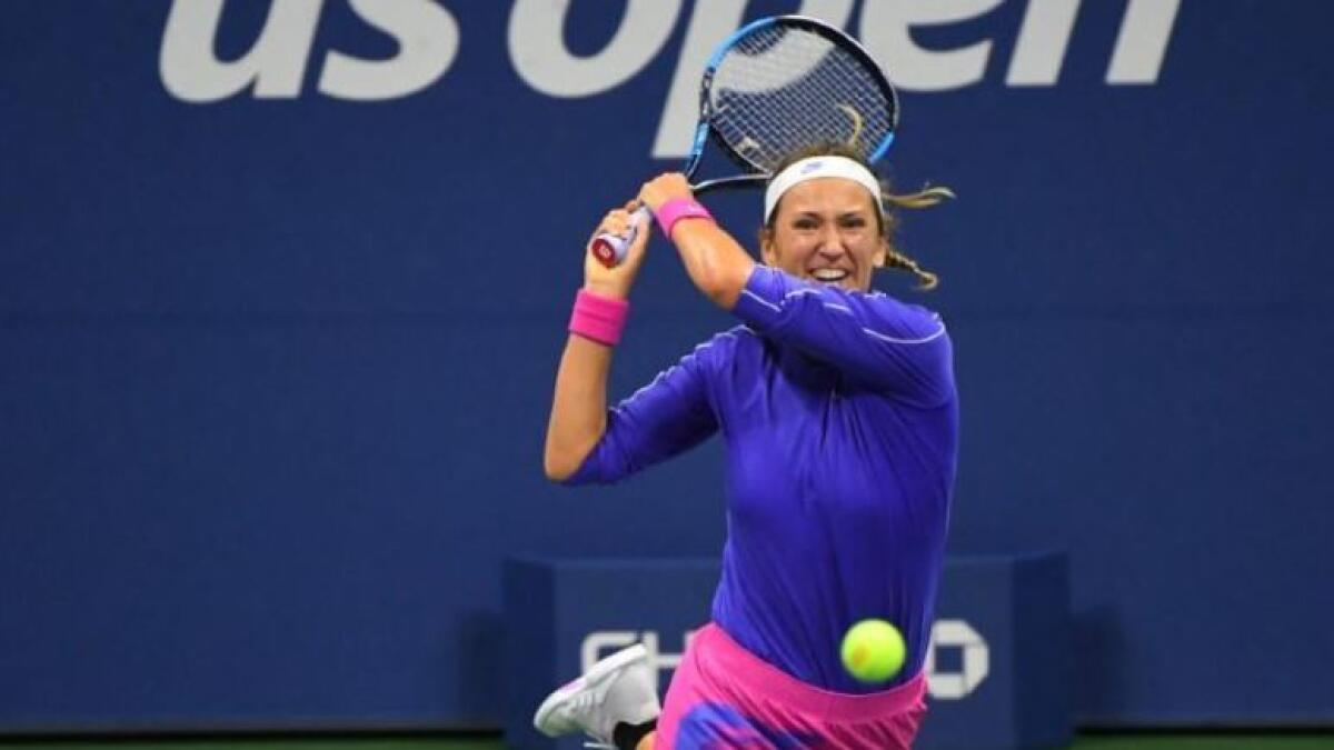 Victoria Azarenka plays a backhand return during her quarterfinal match. (Reuters)
