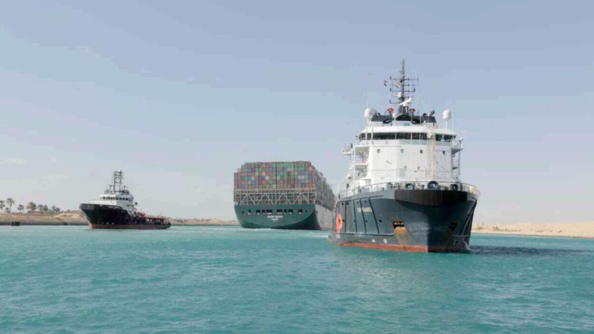In this photo released by Suez Canal Authority, the Ever Given, a Panama-flagged cargo ship is accompanied by Suez Canal tugboats as it moves in the Suez Canal. — AP