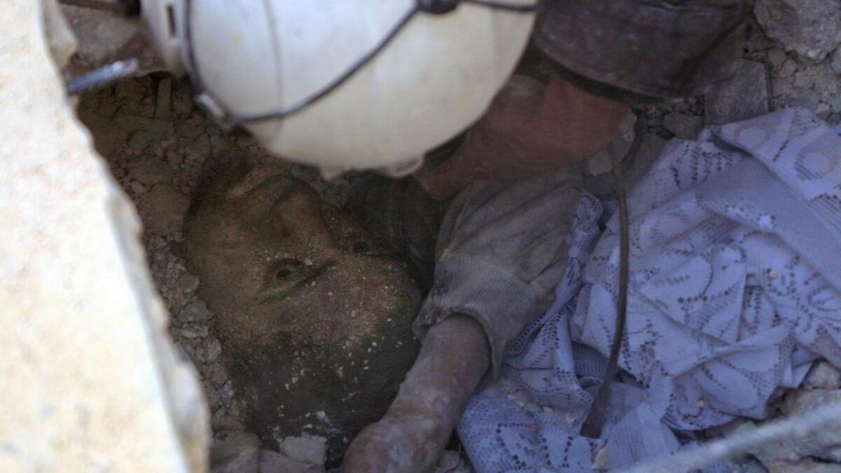 Horrific images emerge of boy pulled out from Aleppo rubble