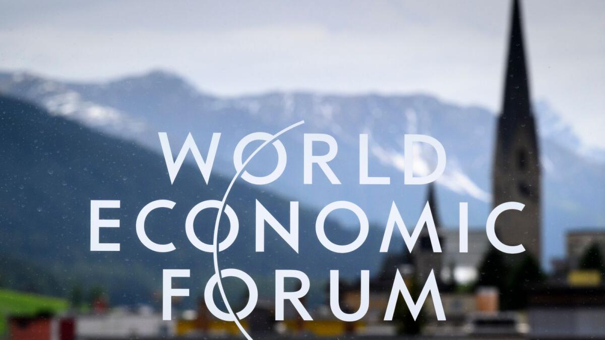 The logo of the World Economic Forum is seen on a window in front of Davos platz village, at the 51st annual meeting of the World Economic Forum (WEF) in Davos, Switzerland. — AP