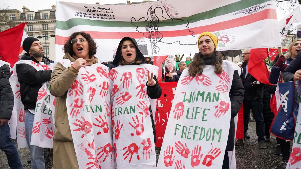 Protesters gather at Marble Arch before they march to Trafalgar Square to protest against the Islamic Republic in Iran following the death of Mahsa Amini, in London, on Sunday. — AP