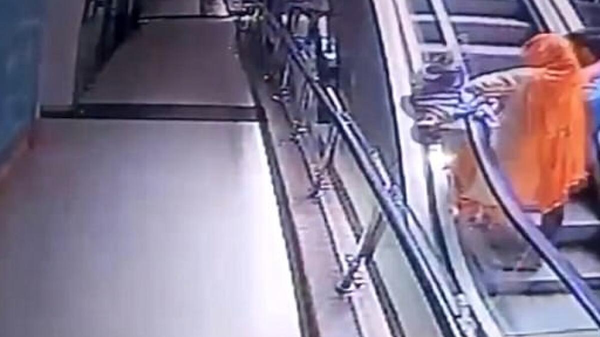 Baby falls to death as mother takes selfie on escalator 