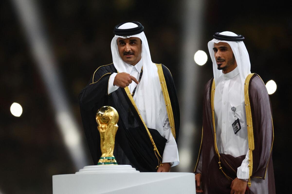 Emir of Qatar Sheikh Tamim bin Hamad Al Thani and the World Cup trophy during the trophy ceremony.