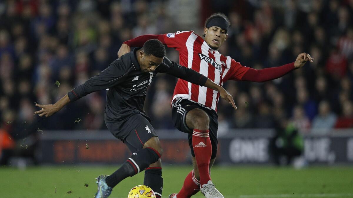 Liverpool’s Jordon Ibe (left) scores his team’s fifth goal. 