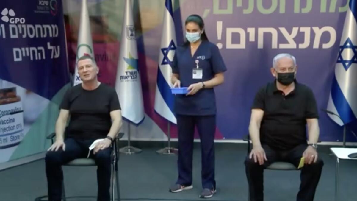 Israeli Prime Minister Benjamin Netanyahu and Health Minister Yuli Edelstein receive their second dose of the Covud-19 vaccine. (Screengrab from video shared by Yuli Edelstein)