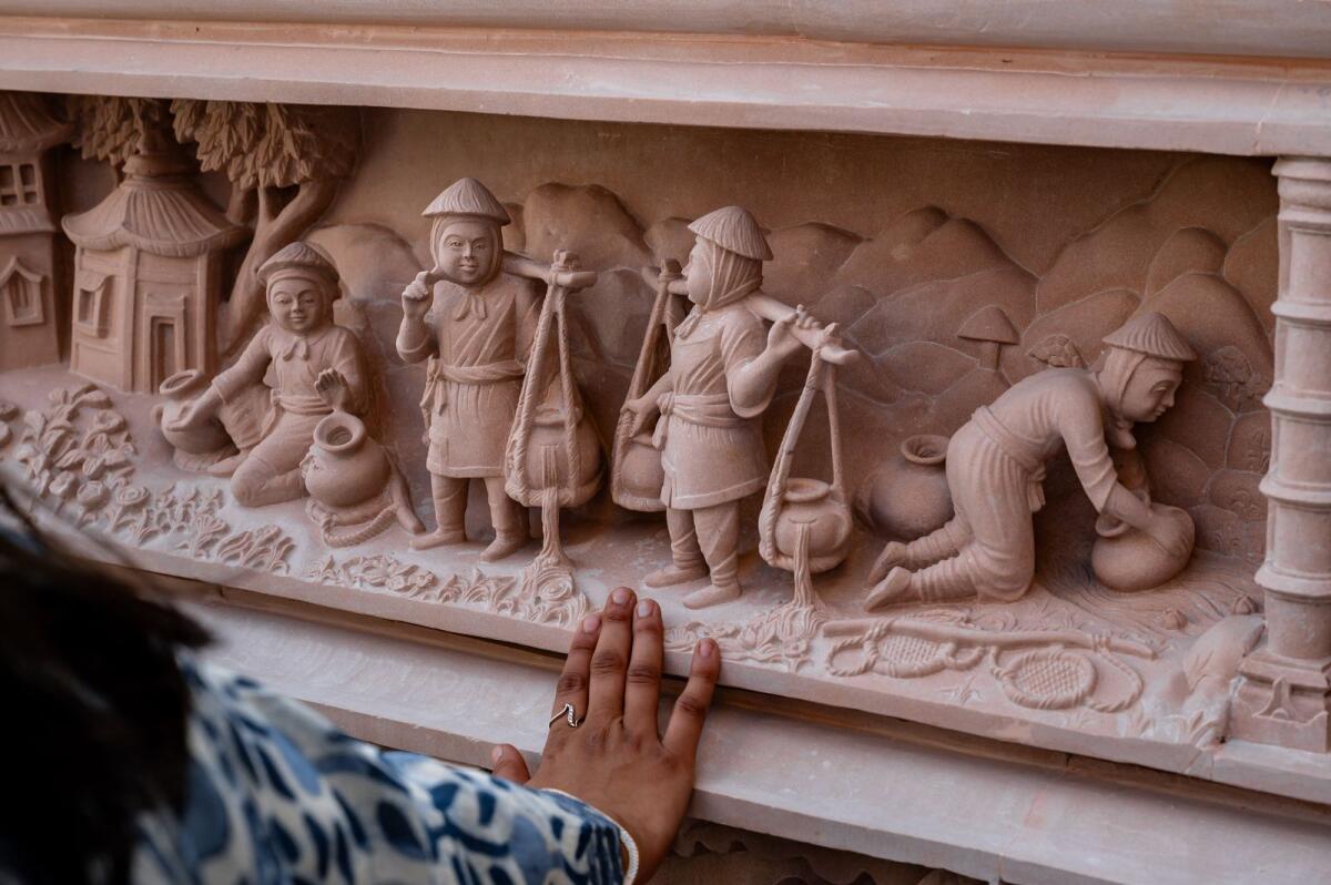 Detailed view of stone carvings that depict stories from Hindu scriptures