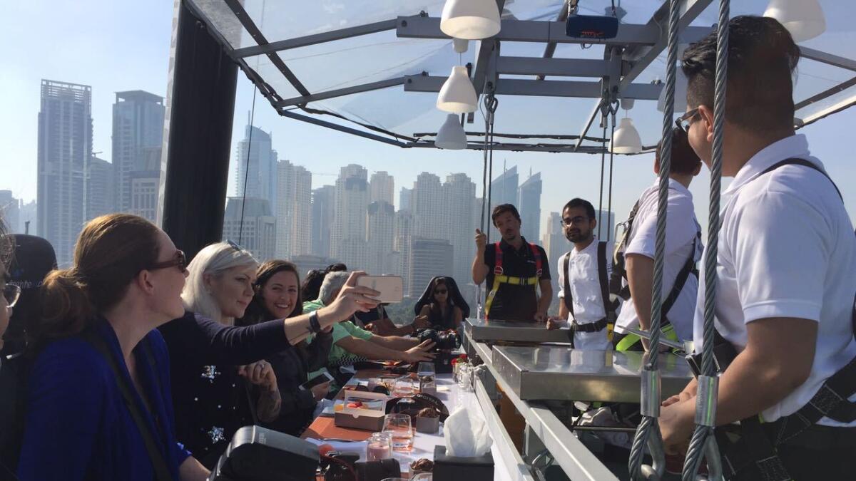 Popular dinner concept 'Dinner in the Sky' has come to Dubai International Marine Club. Never complain about 'ambience' ever again. Photo by Dhes Handumon