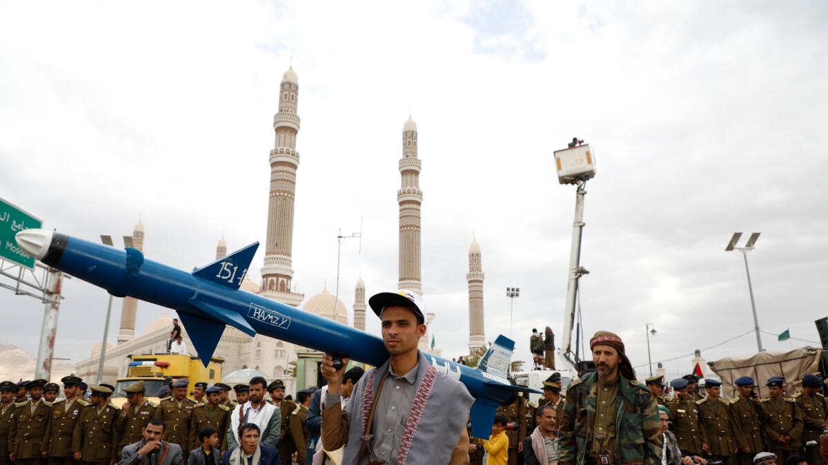 Houthi supporters carry a mock missile during a rally against the US-led strikes against Yemen and in the support of Palestinians in the Gaza Strip, in Sanaa. — AP file