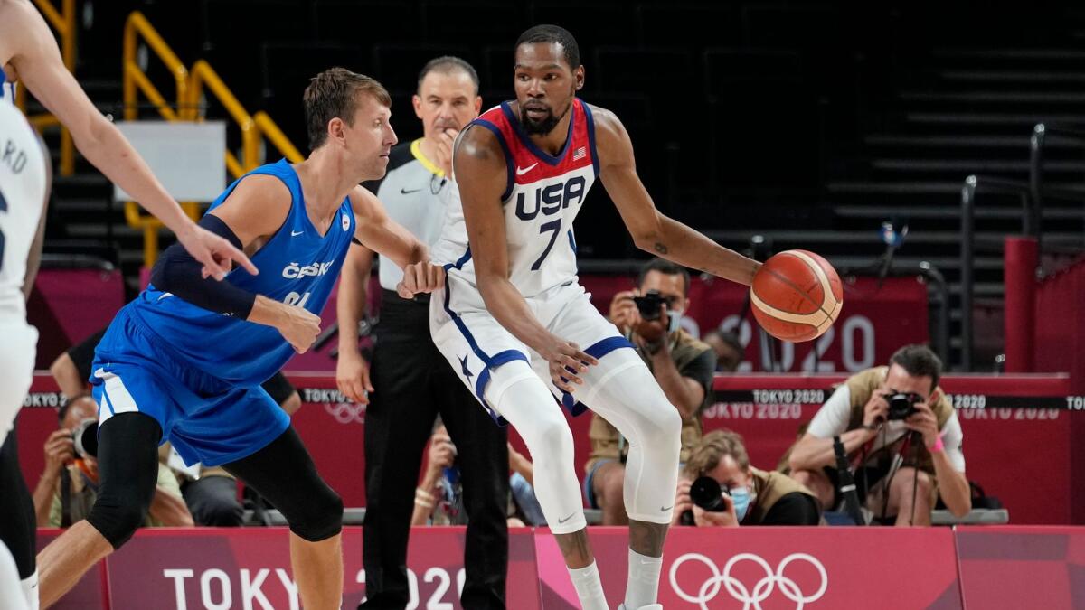 United States's Kevin Durant (7) works the ball against Czech Republic's Jan Vesely (24) during a men's basketball preliminary round game. — AP