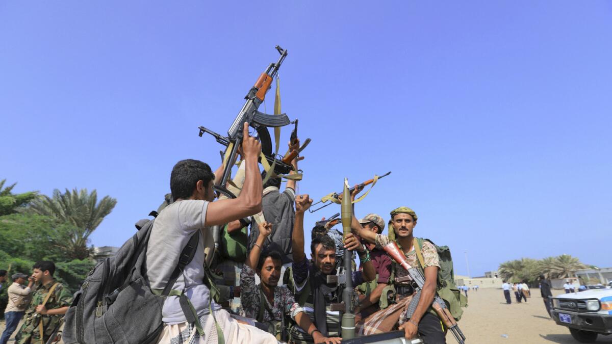 Reuters file photo shows Houthi rebels riding on the back of a truck.