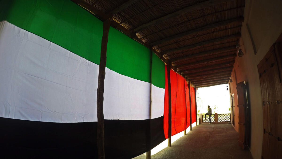 A huge UAE flag is displayed at the Souk Al Shanasiya, a traditional style market which is under construction at heart of Sharjah.– Photo by M.Sajjad/Khaleej Times