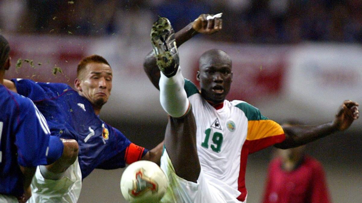 Senegalese midfielder Papa Bouba Diop (right) battles for a ball with Japanese midfielder Hidetoshi Nakata during the Kirin Challenge Cup 2003. AFP file