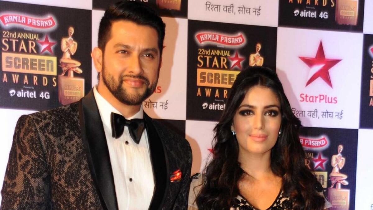 Aftab Shivdasani (L) poses with his wife. -AFP