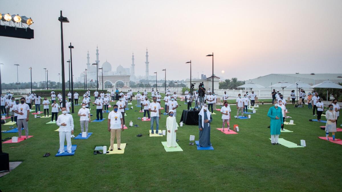 Sheikh Nahyan bin Mabarak Al Nahyan, UAE’s Minister of Tolerance and Coexistence, and Indian Ambassador to the UAE Pavan Kapoor try out some Yoga poses during the International Day of Yoga event in Abu Dhabi. Supplied photo
