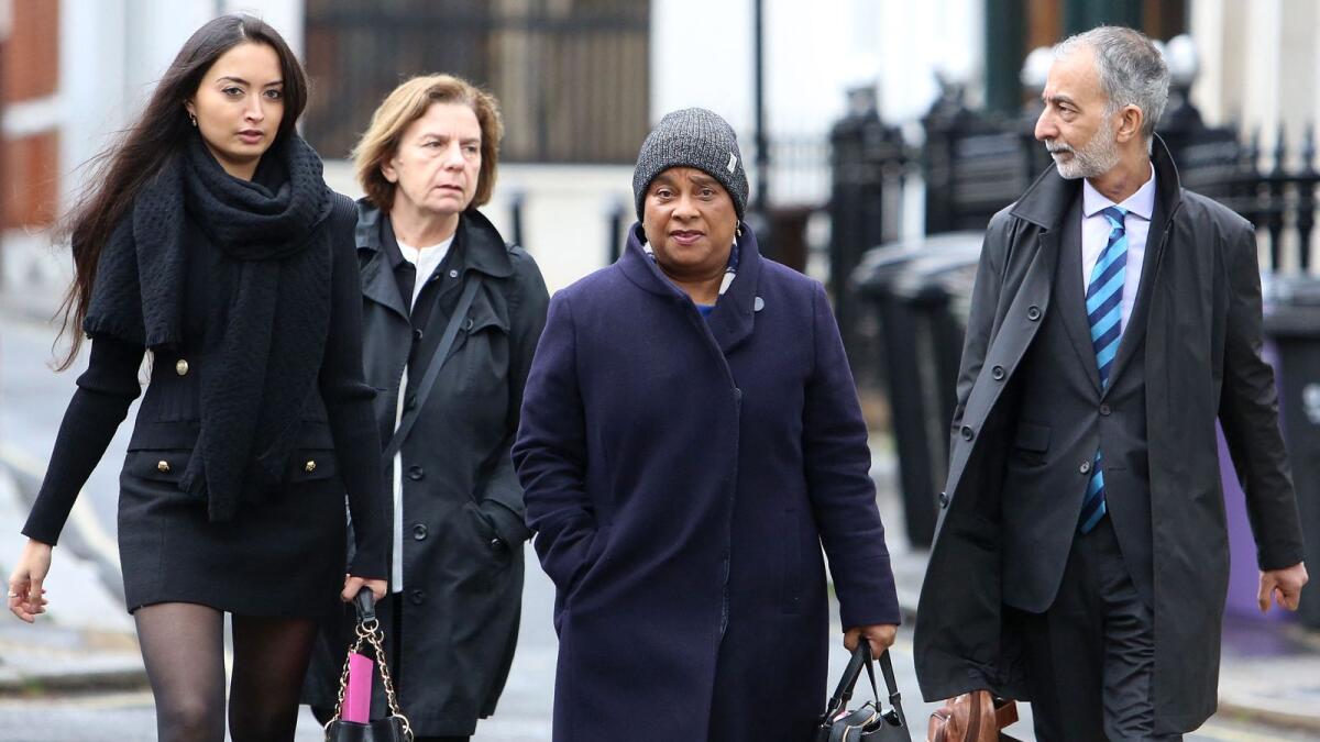 Doreen Lawrence, mother of murdered Stephen Lawrence (2R), arrives at the Royal Courts of Justice, Britain's High Court, in central London on March 29, 2023. — AFP