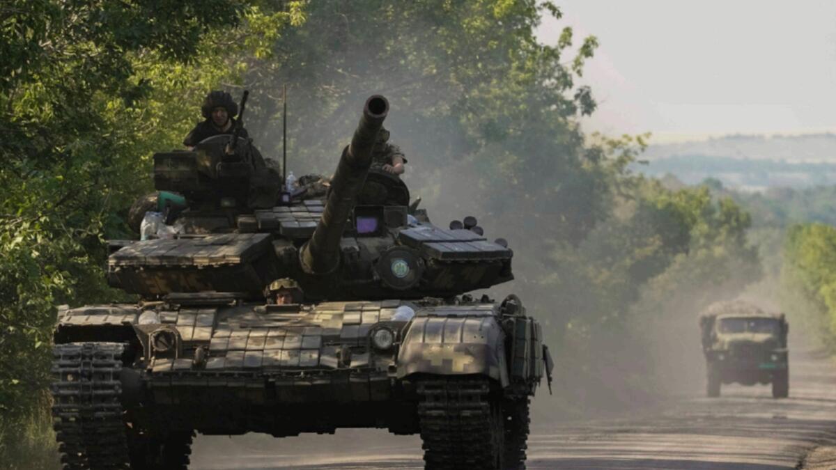 A Ukrainian tank drives in Donetsk region. — AP