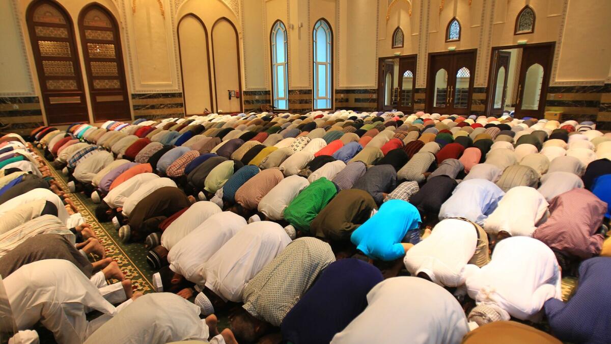 The faithful offer prayers at Al Karama Mosque in Dubai.  Photo by Neeraj Murali/Khaleej Times