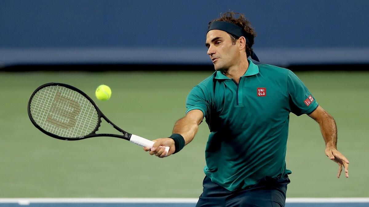 Federer and Djokovic advance, Serena quits