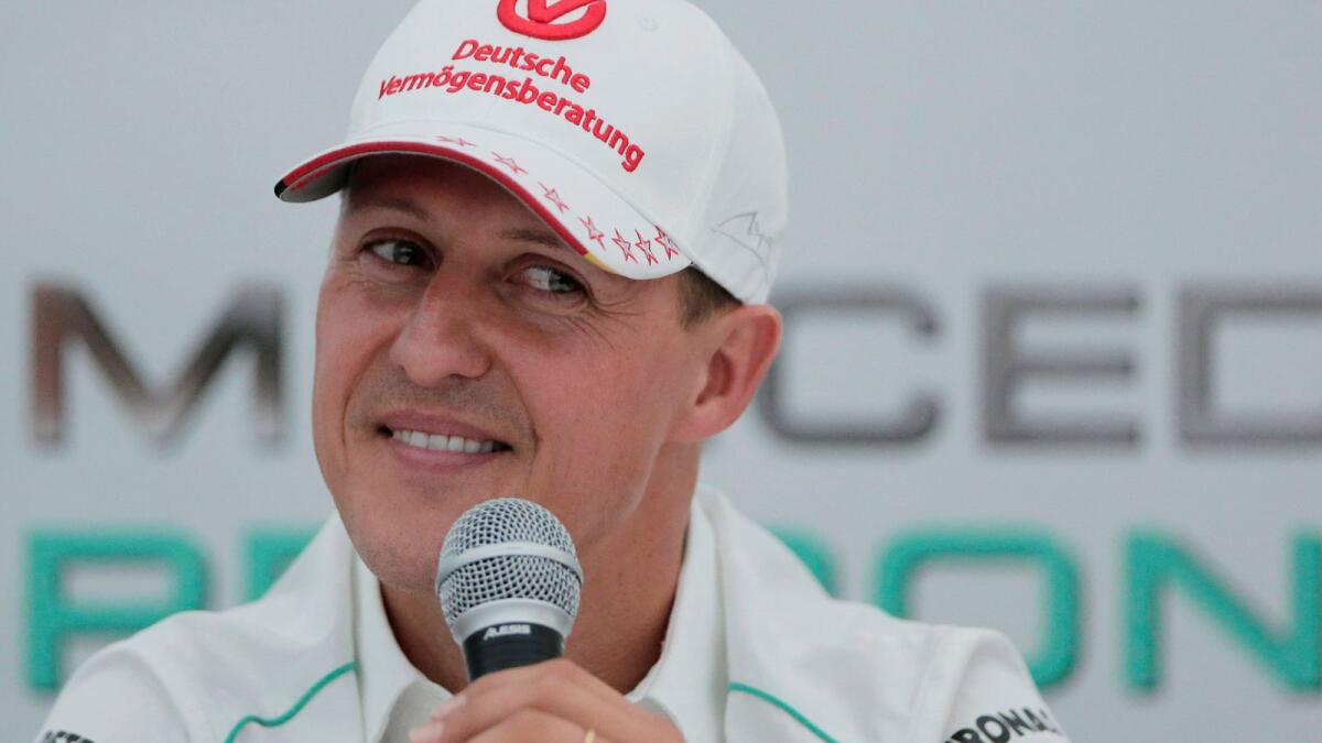 Michael Schumacher announces his retirement from Formula One during a press conference at the Suzuka Circuit venue for the Japanese Formula One Grand Prix in Suzuka, Japan, October 4, 2012. — AP file